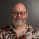 Bald, Gray-Bearded Glasses Wearing RIT Professor Stephen Jacobs in Bamboo Flowered Shirt